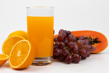 Fresh Orange juice in glass isolated on white background, fresh orange jiuce drink with grapes for healthy drink