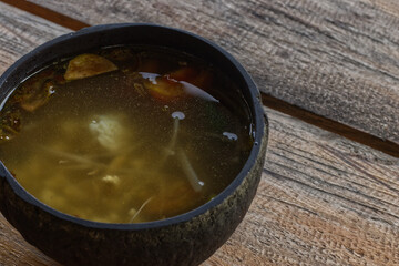 Soto bathok is a typical Indonesian soup served with coconut shells as a bowl.