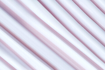 cosmetic smear cream texture on pastel pink background