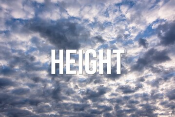 Fototapeta premium HEIGHT - word on the background of the sky with clouds.