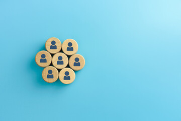 Teamwork, Organization concept, Wooden cubes with person icons on blue background, copy space