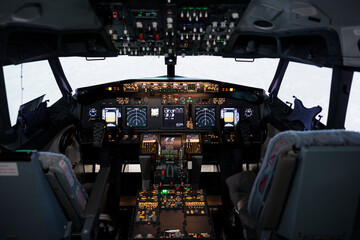 Nobody in airplane cockpit with electronic flying navigation panel, control command with buttons...