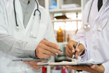 The doctor checks the patient's history in the hospital