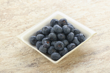 Sweet ripe blueberry heap in the bowl