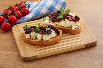 Bruschetta with soft cheese and tomato