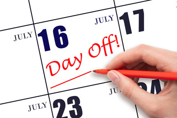16th day of July. Hand writing text DAY OFF and drawing a line on calendar date 16 July. Vacation...