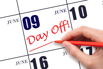 9th day of June. Hand writing text DAY OFF and drawing a line on calendar date 9 June. Vacation...