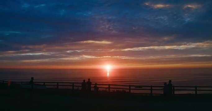 Group Of People Enjoying Beautiful Romantic Sunset View Over The Sea At Perran Sands Beach In Perranporth, Cornwall, England, UK. - Timelapse