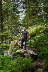 Obraz premium Nature photographer hiking in the forest