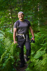 Nature photographer hiking in the forest