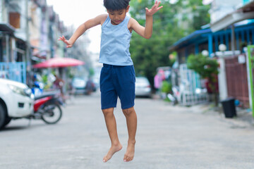 Asian boy Show fun faces and gestures that has been played by jumping