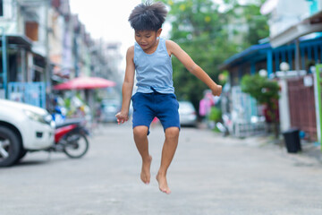 Asian boy Show fun faces and gestures that has been played by jumping