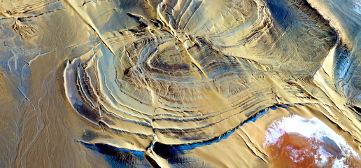 abstract landscape photo of the deserts of Africa from the air emulating the shapes and colors of...