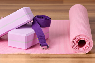 Yoga blocks, exercise mat and yoga belt for training. Yoga equipment.
