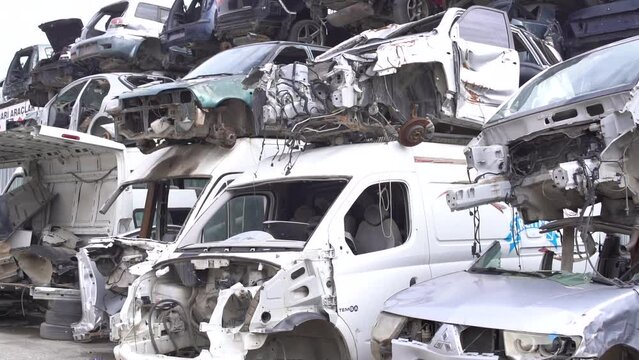 Scrapped cars, crashed cars.
Scrap cars are used for recycling and second-hand spare parts. Pile of scrap vehicles.
