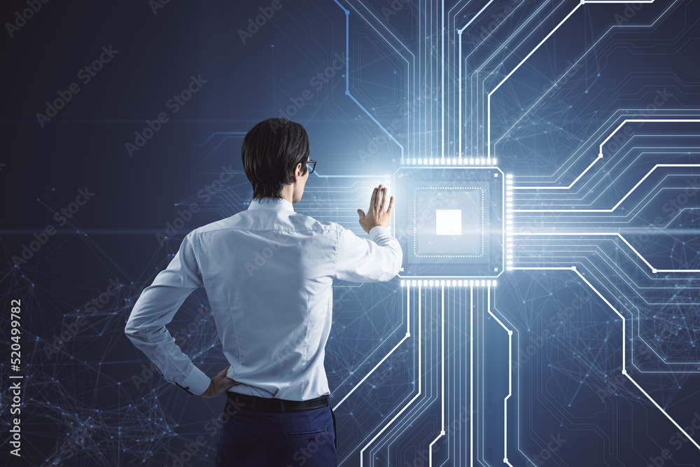 Poster back view of young businessman using creative glowing chip circuit hologram on dark background. cpu 
