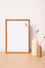 Mock up empty wooden frame mockup, dried grass in vase on white background, interior, home design. Art concept. copy space