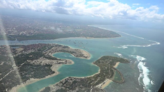 aerial view of nusa dua, benoa and sanur from plane, slow motion