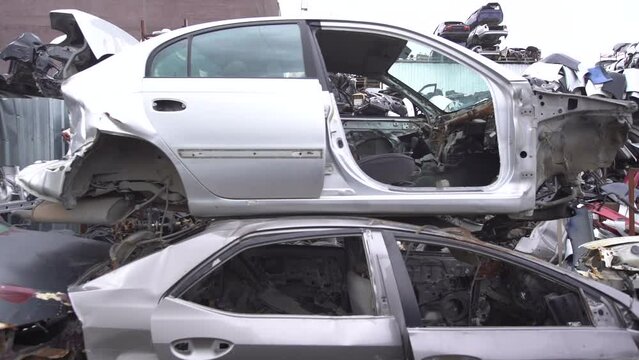 Scrapped cars, crashed cars.
Scrap cars are used for recycling and second-hand spare parts. Pile of scrap vehicles.
