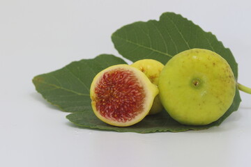 fig fruits  and leaves on white background