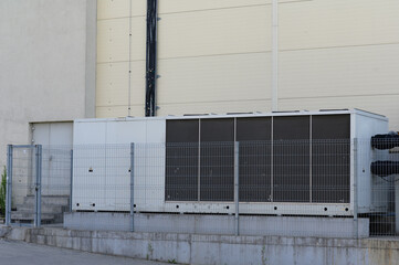 Fototapeta na wymiar Large industrial air conditioner on the side of the mall.