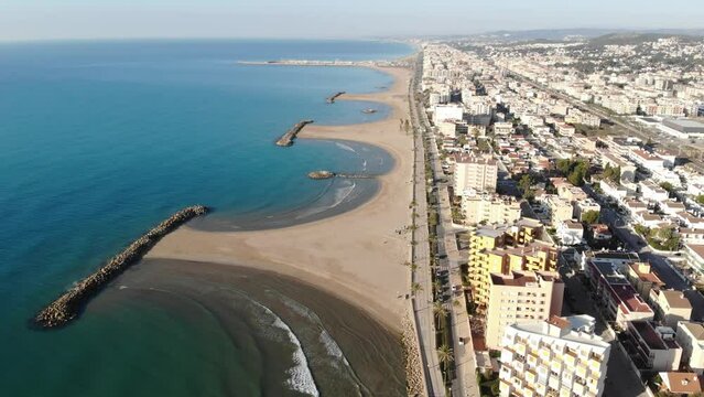 Aerial drone view of Playa de Cunit on sunny winter day, Tarragona, Spain 