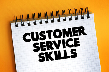 Customer Service Skills text on notepad, concept background