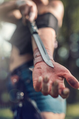 sharp knife in female hand at outdoor