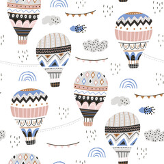 Seamless hand drawn pattern with hot air ballons, clouds. Trendy modern texture for fabric, wallpaper, textile, apparel. Vector illustration
