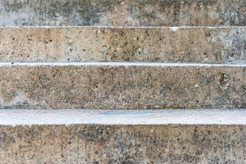 Old stairs.Old aged beige,gray stairs textured background.Closeup.