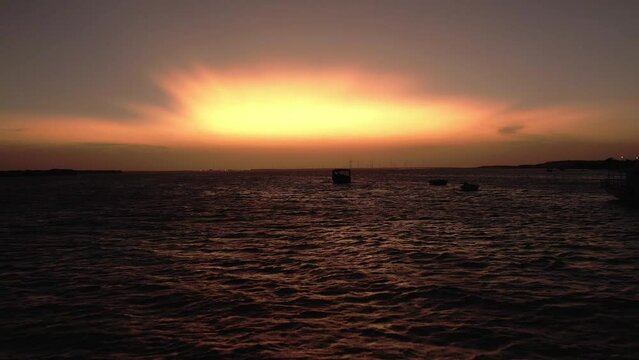 Flyover sea surface during epic sunset, Brazil Seascape