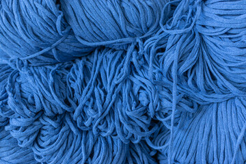 a close-up of yarn ball on a blue background