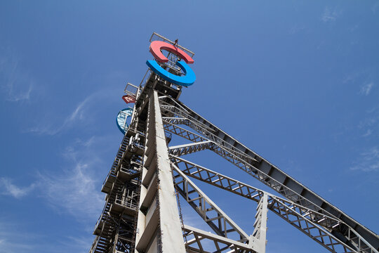 Silesia City Center shopping mall, located on the site of former coal mine KWK Gottwald. SCC logo sign at antique tower shaft Jerzy on July 21, 2022 in Katowice, Poland.