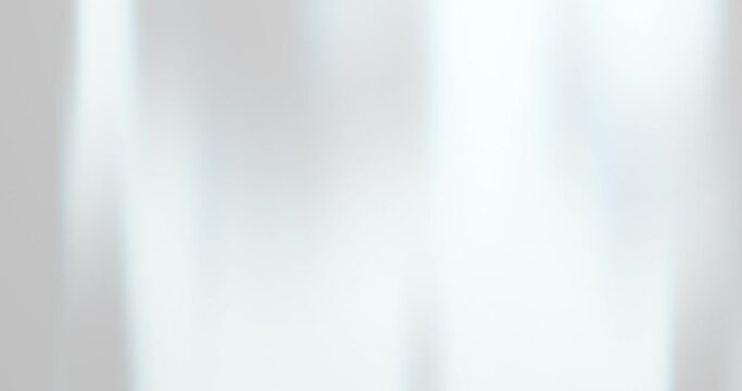 White clean abstract background with light leak and bright motion. White loop simple abstract background. Pearl and crystal effect on white backdrop in looping footage animation