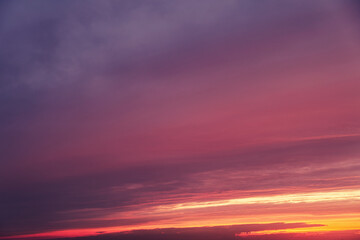 Naklejka na ściany i meble Evening sky with pink clouds at sunset, cloudy landscape