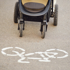 A baby stroller on a bike path in violation of traffic rules. The movement of the stroller is not...