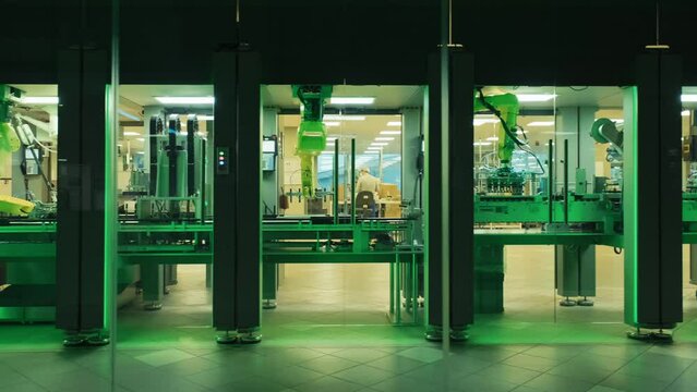 Industry 4.0 Modern Factory. Industrial High Precision Machinery is in cosmetic factory. automatic conveyor belt of factory line. Automated machine. Robotic equipment.Assembly Line robot arm.