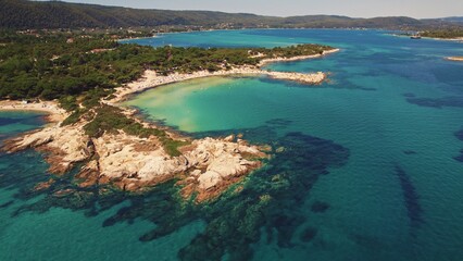 Fototapeta na wymiar Naturally stunning Karydi beach in Greece surrounded by shallow see-through not polluted sea water. Aerial shot. High quality photo