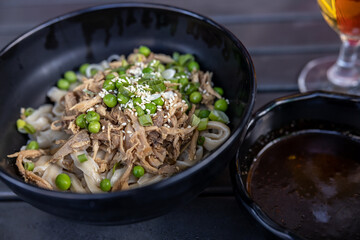 Biang biang noodles in a bowl over the table