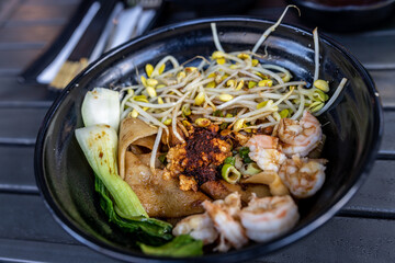 Biang biang noodles in a bowl over the table