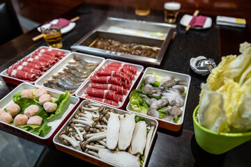 Hot pot chinese food ingredients over the table