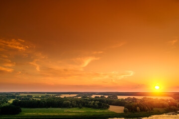 Fototapeta premium Orange sunset in the countryside