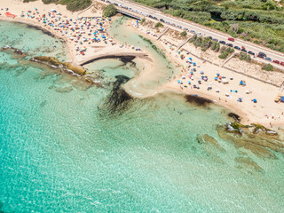 Drone top down view of San Pietro in Bevagna beach, Manduria, Salento, Puglia, Italy, in the summer