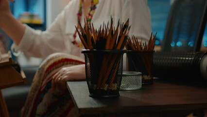 Colorful pencils and artistic tools on table used to draw sketch, creating professional artwork masterpiece. Drawing equipment for art and craft model, creative skills and imagination. Close up.