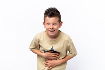 Little caucasian boy isolated on white background smiling a lot