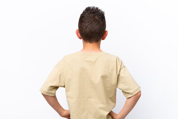 Little caucasian boy isolated on white background in back position