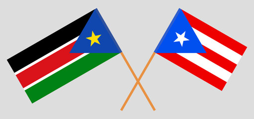 Crossed flags of South Sudan and Puerto Rico. Official colors. Correct proportion