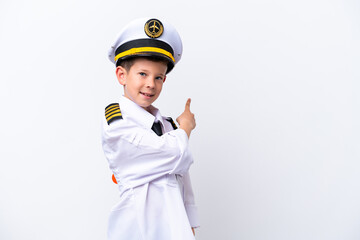 Little airplane pilot boy isolated on white background pointing back