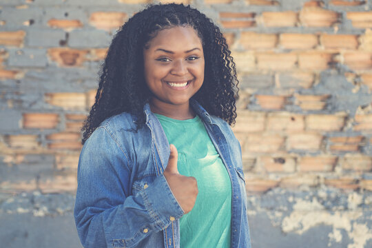 African american female young adult showing thumb up