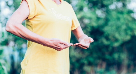 woman doing qi gong outdoors